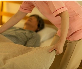 Home Care Specialist caring for senior man. 