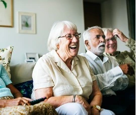 Group of senior citizens watching tv. 